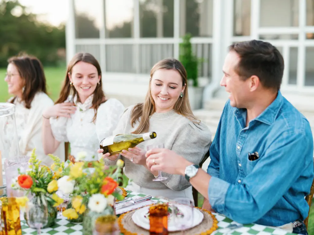 Sitting down for Jessie Randall and Courtney Barton's countryside dinner at Kitchenette Farm in Round Top: Maggie Umsted, Wallis Sugg, Sarah Rothwell, JJ Barton (Photo by Harlow & May)