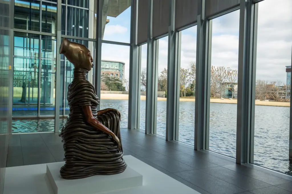 Modern Art Museum - Wangechi Mutu's "The Seated III," 2019, with its view of the reflecting pool. 
