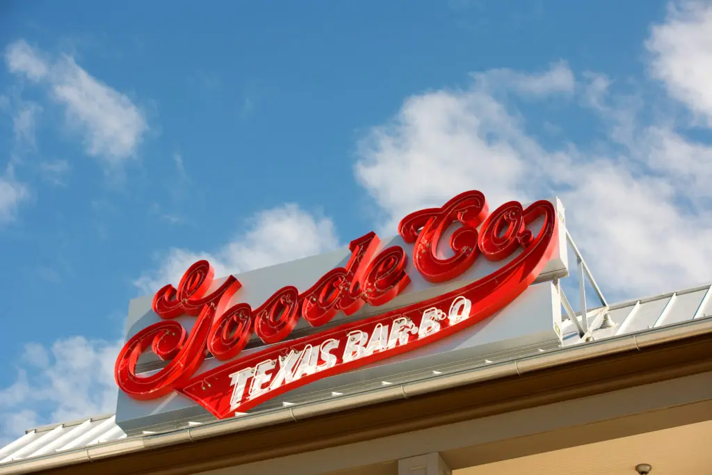 A red neon sign beckons BBQ diners to the famed Goode Co. Barbecue location in the Woodlands area. (Photo by Paula Murphy)