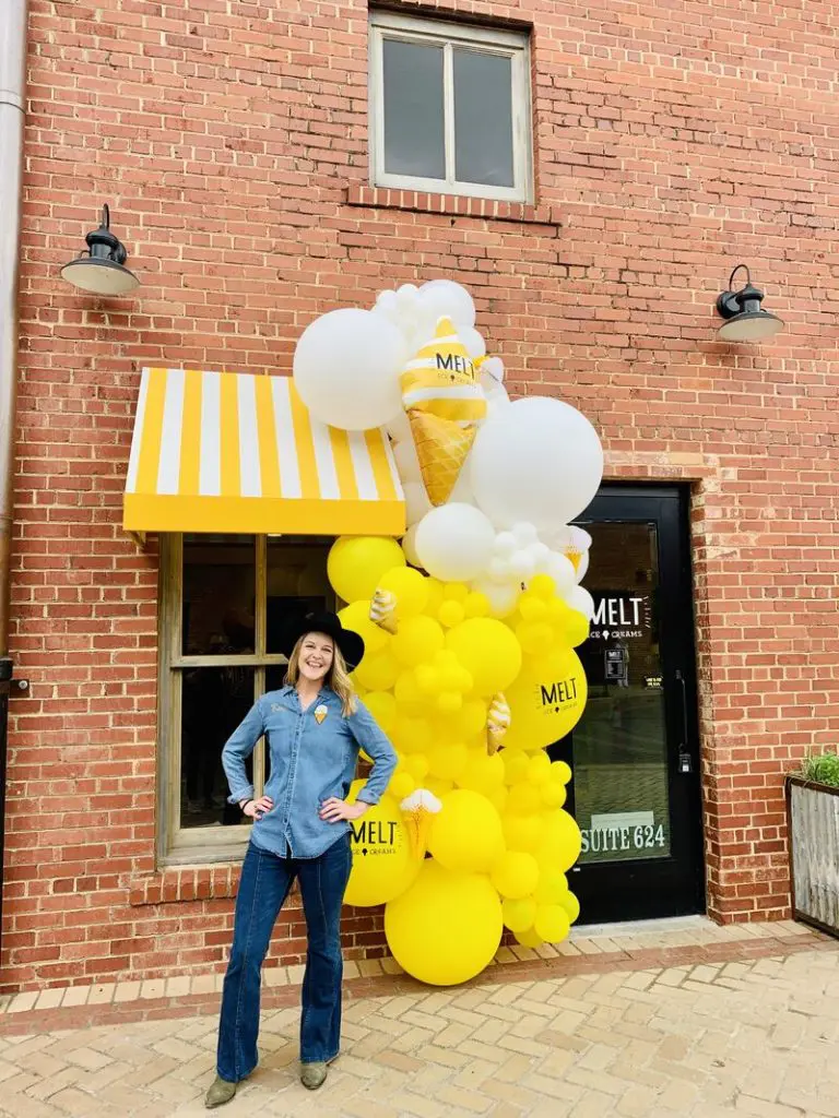Owner Kari Crowe cowgirl's up, in front of her newest MELT Ice Creams in Mule Alley.