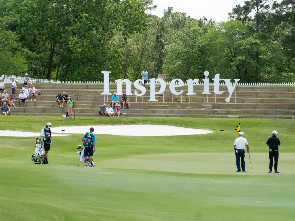 The setting behind the 18th green with the hill at Woodlands Country Club makes for a well-framed finish. (Photo by F. Carter Smith)