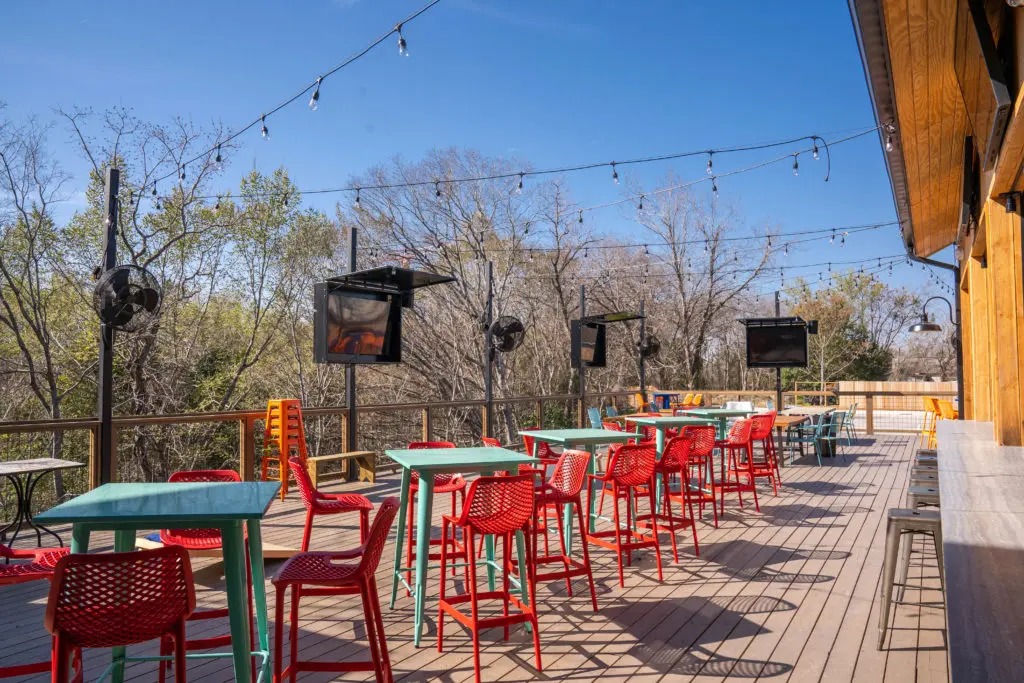 Another view of the outdoor patio area situated in a park like setting near the White Oak Bayou Trails. Photo by Michael Anthony.