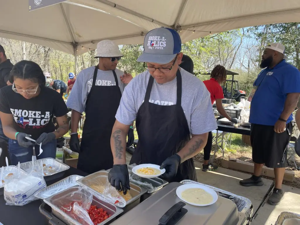 Smoke-a-Holics served the perfect slice of brisket atop cheese grits. Photo by Courtney Dabney.