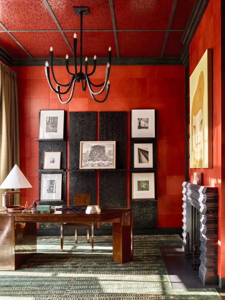 An André Sornay ash desk and chair (1937) are paired with a Sornay table lamp (1935). Works by Michaël Borremans, Luc Tuymans, Frederick Sommer, Dan Fischer, Jay DeFeo, and Ikeda Manabu rest on the shelves behind. 