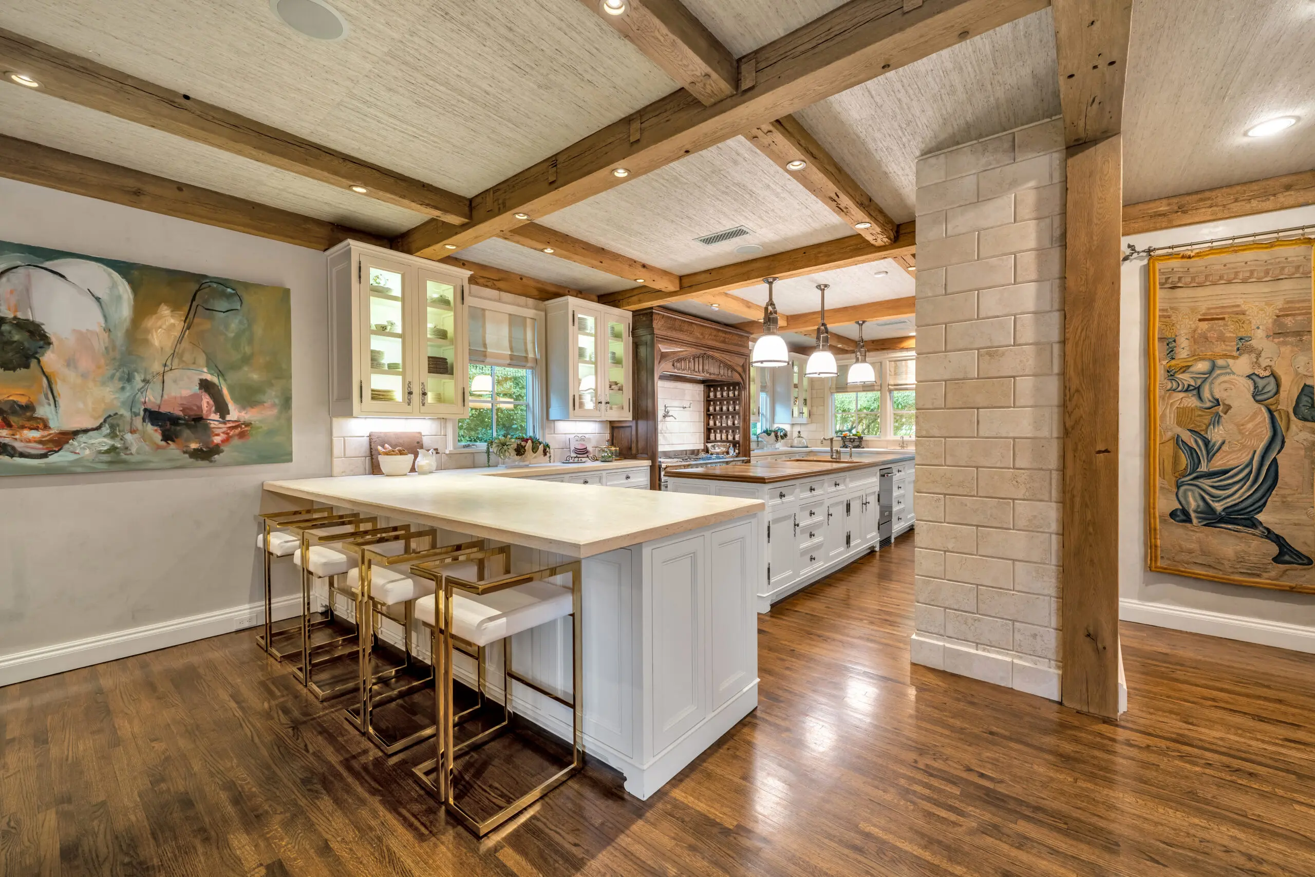 2710 – Old World beams and hood accents mix with modern bar seating overlooking the kitchen.