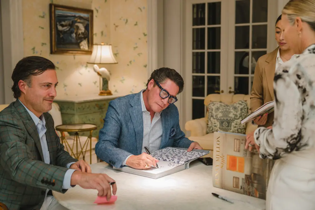 Thomas Lloyd and Bryan Huffman signing in the sunroom. (Photo by Johnny Than)