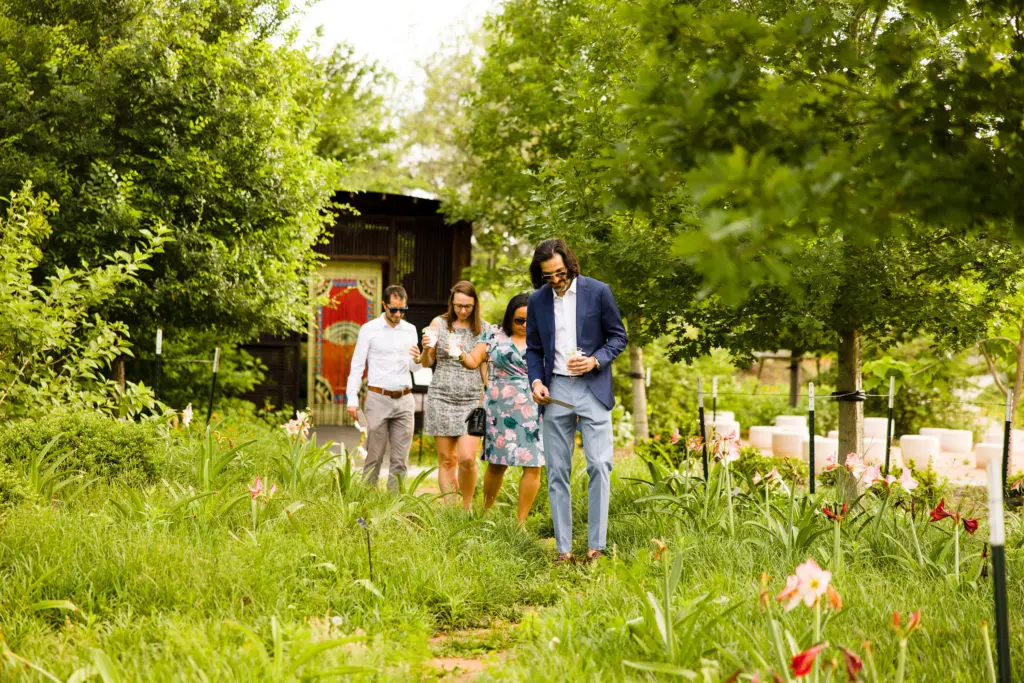 Guests stroll through Houston Botanic Garden during The Secret Garden Party (Hung L. Truong Photography)