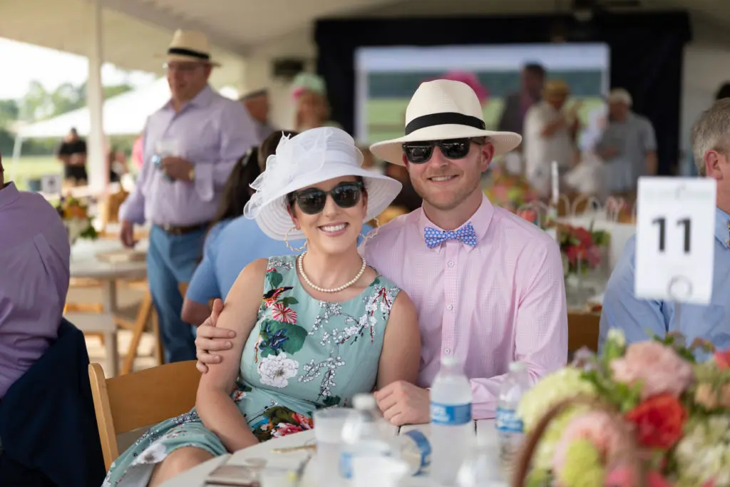 Amy & Jon Heibel  at the Bo's Place 'Hats, Hearts & Horseshoes' benefit at Houston Polo Club. (Photo by Daniel Ortiz)