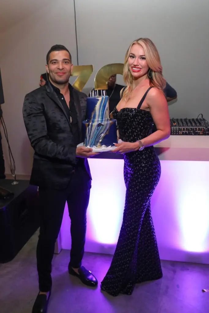 CAMH gala After Party chair Adel Sadek of CIEL Restaurant + Lounge receives a surprise birthday cake from Desiree Jacobs (Photo by Priscilla Dickson)