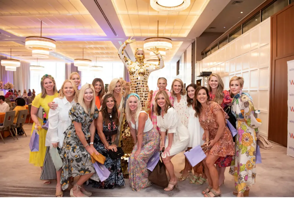 Guests enjoy entertainers like the mirrored stilt walker as they indulge in mimosas and brunch favorites (photo by Tamytha Cameron)