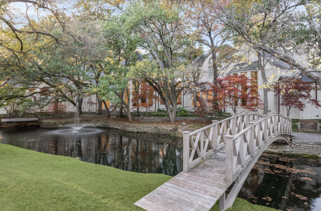Located at 9250 Meadowbrook Drive, the home is situated on a 2.3-acre corner lot backed by a creek that’s visible from multiple rooms