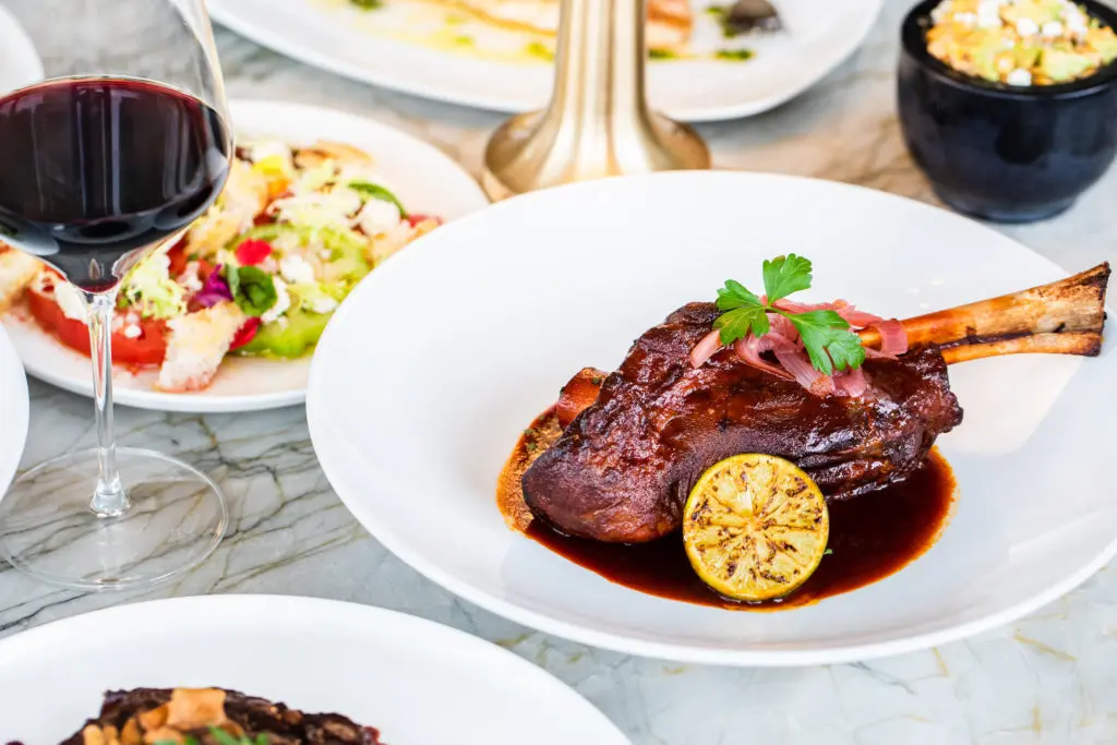 A hearty lamb shank barbacoa graces the new menu created by Jesus "JB" Babaran. (Photo by Rebecca Wright)