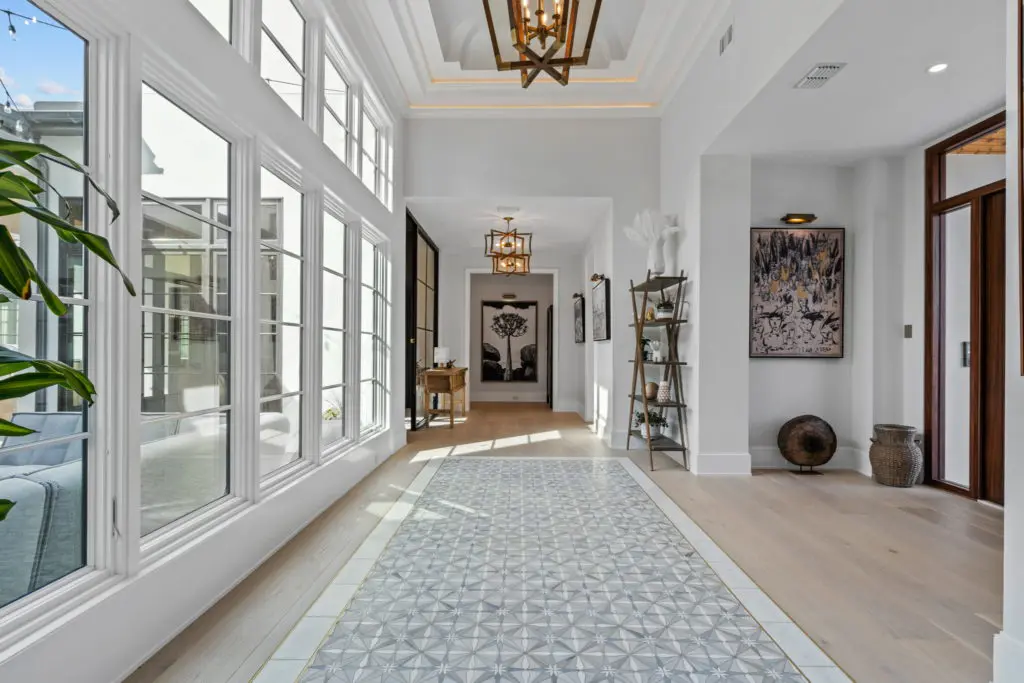 The entry with a view to the outdoor areas and its inlaid marble rug at 4632 Esprit Ave.