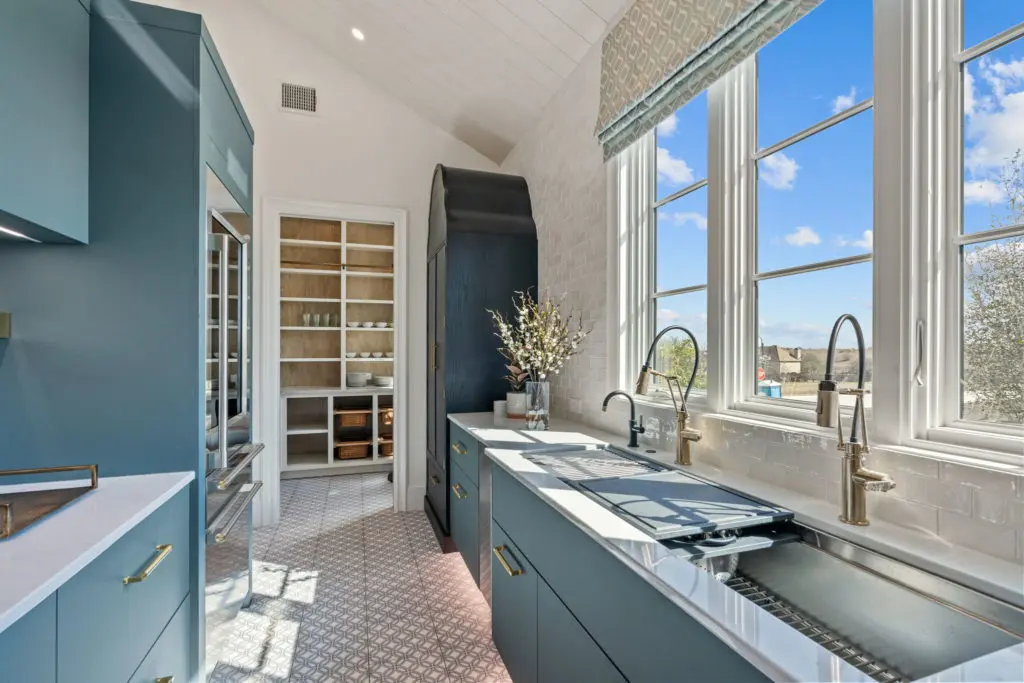 A sunny back kitchen keeps the mess out of view and adds to the entertaining possibilities.