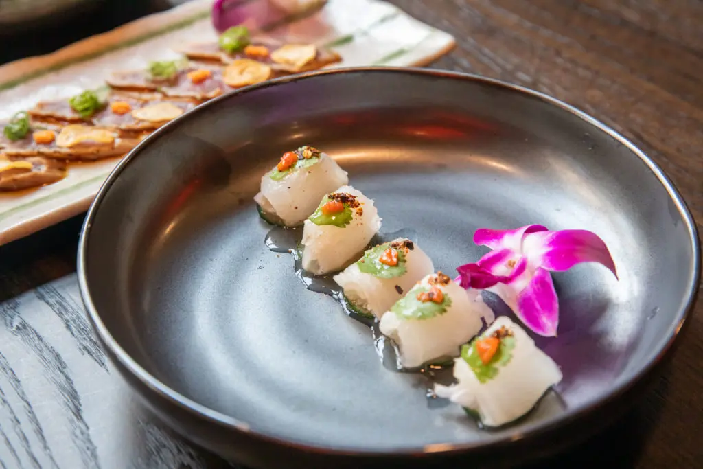 The ceviche-style Hirame is made with olive flounder topped with cucumber, pickled shallots, cilantro, aji limo, merquén, lime juice and black pepper. (Courtesy of Flagship Restaurant Group)