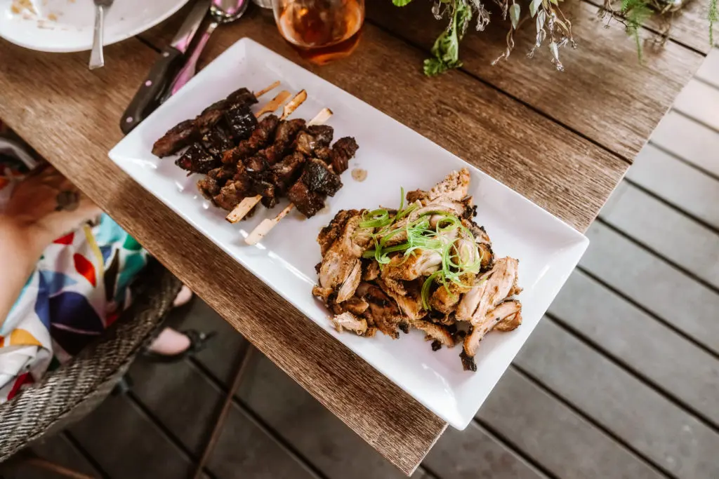 West African-inspired fare from ChòpnBlọk: Roadside steak and Blọk chicken. (Photo by William Issac)