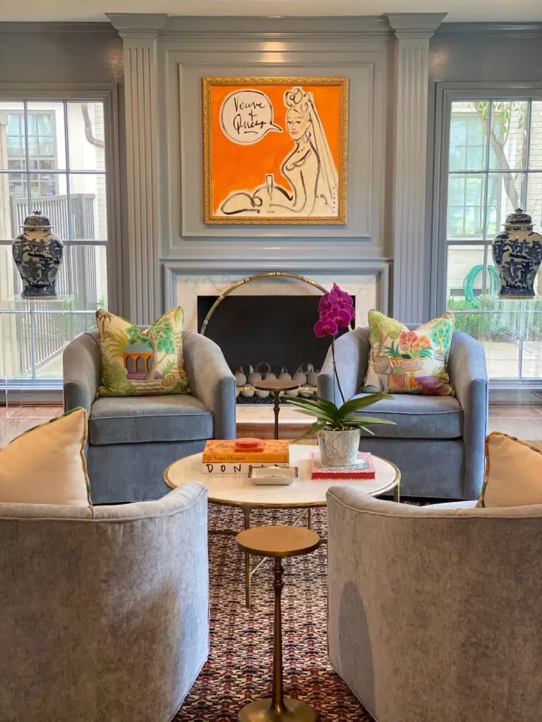 A high gloss French blue pairs beautifully with the Veuve Clicquot orange of a Donald Robertson commissioned portrait.