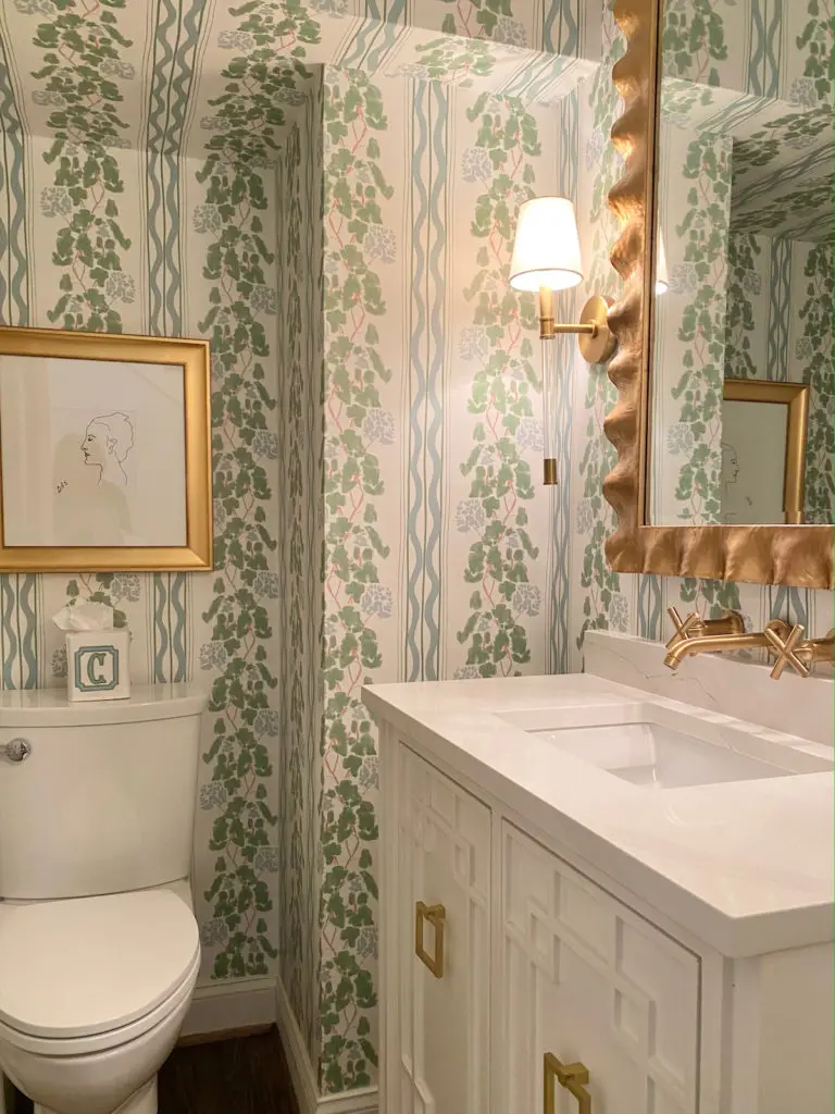One of the Carrolls' favorite elements of the powder bathroom: a wall mounted faucet from Kohler.