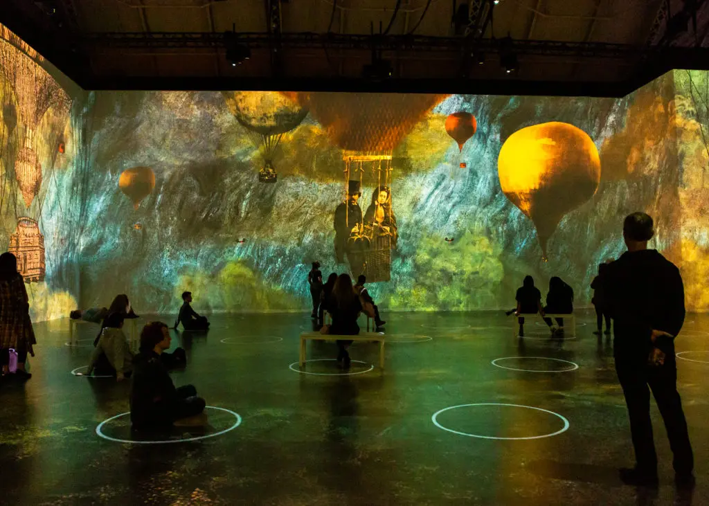 Stunning artwork is projected onto all four walls at Lighthouse ArtSpace Houston for "Immersive Monet & The Impressionists." (Photo by Patrick Hodgon)