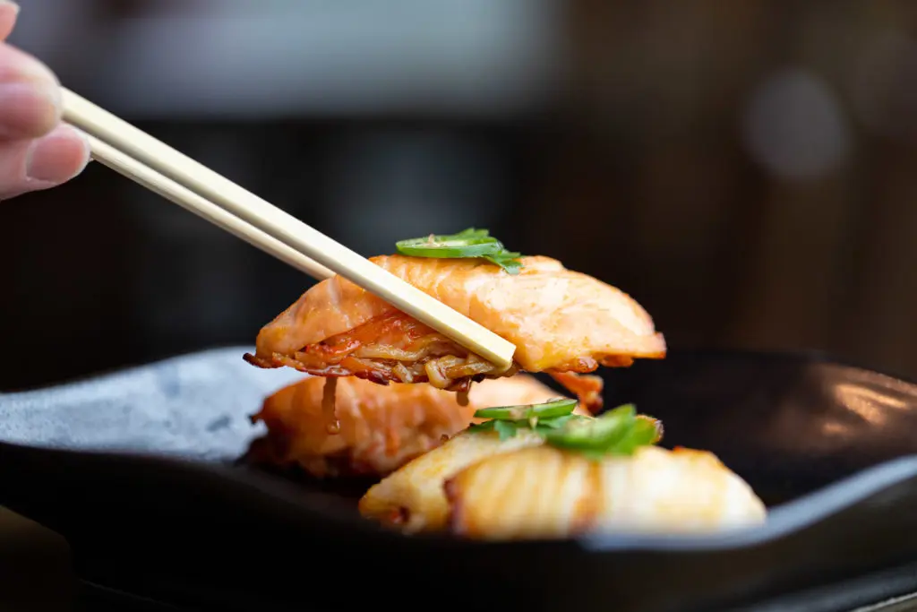 This specialty nigiri section of the menu features this baked Atlantic salmon atop a spicy crab mix, topped with ponzu sauce. (Courtesy of Flagship Restaurant Group)