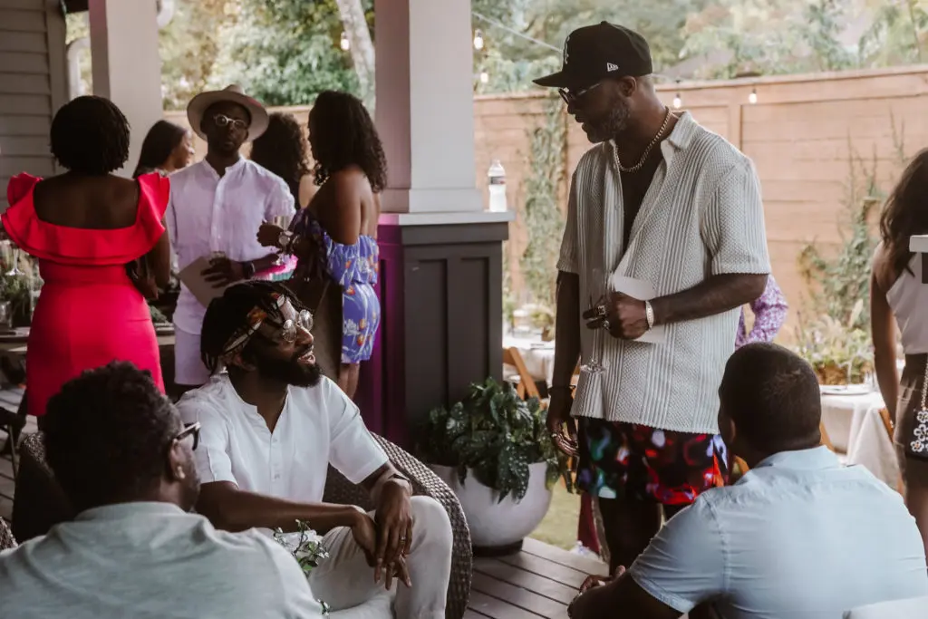 Kevin Barnett (standing) visits with CoolxDad supporters. (Photo by William Issac)