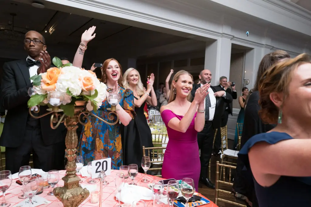 Guests at the 2022 Leukemia & Lymphoma Society Man & Woman of the Year announcement party cheer the record proceeds. (Photo by Daniel Ortiz)