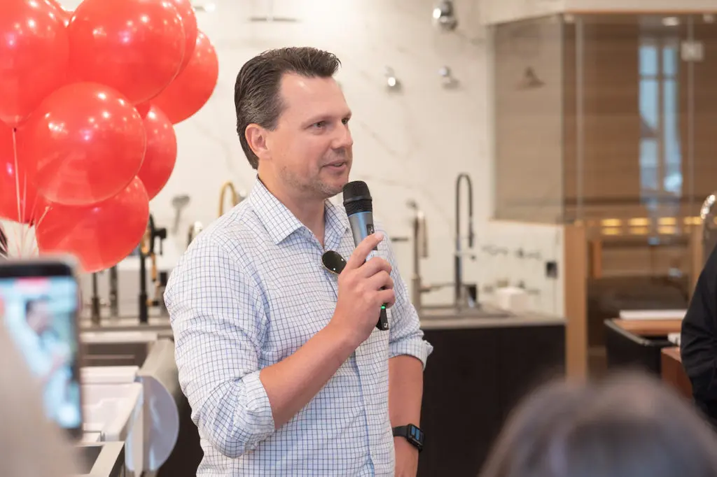 Dr. Micheal Bublewicz talks about his wife's cancer at Chrisd Bolio's fundraiser at Baths of America (Photo by Wilson Parish)