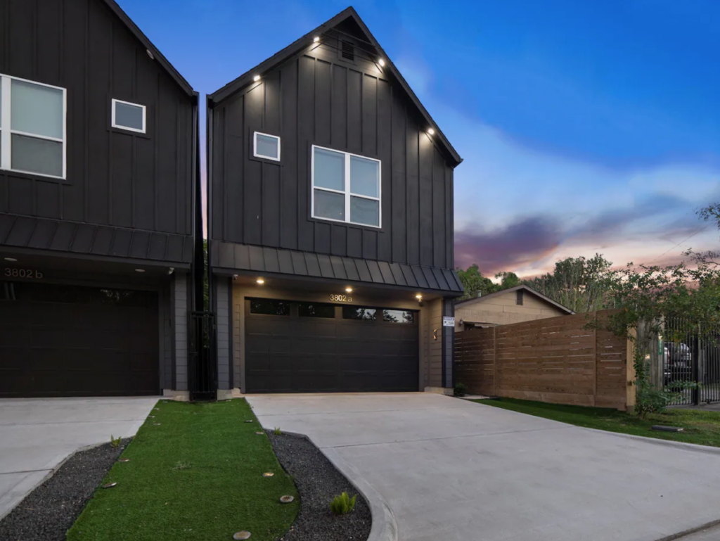 The modest exterior of the Good Vibes HTX Airbnb belies the stylish interiors and lavish garden.