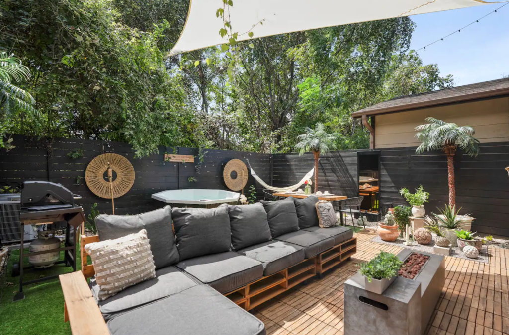 The back garden is fully furnished and ready for exuberant outdoor entertaining.