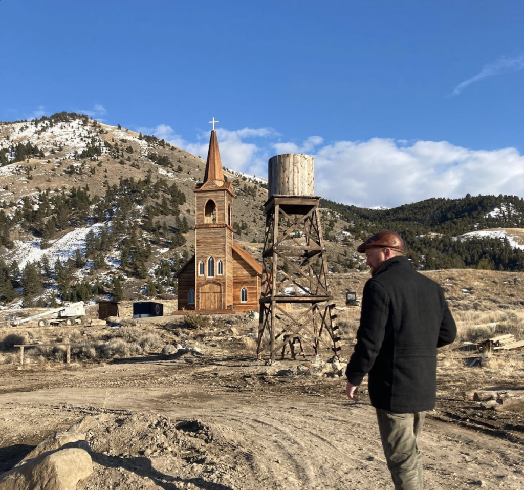 Director Richie Gray searches for an angle on the set of Murder at Yellowstone City.