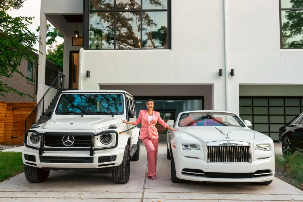 Julia Wang, CEO and Broker of NextGen Real Estate, with cars provided by Houston Luxury Car Rental.