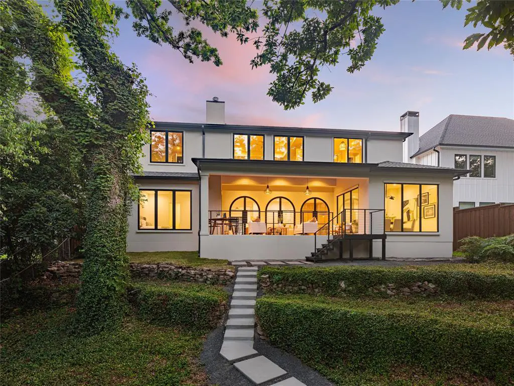 Situated on a prime, creekside lot by beloved Lakewood Park, 3820 Frontier Lane was designed and constructed with a West Coast sensibility.
