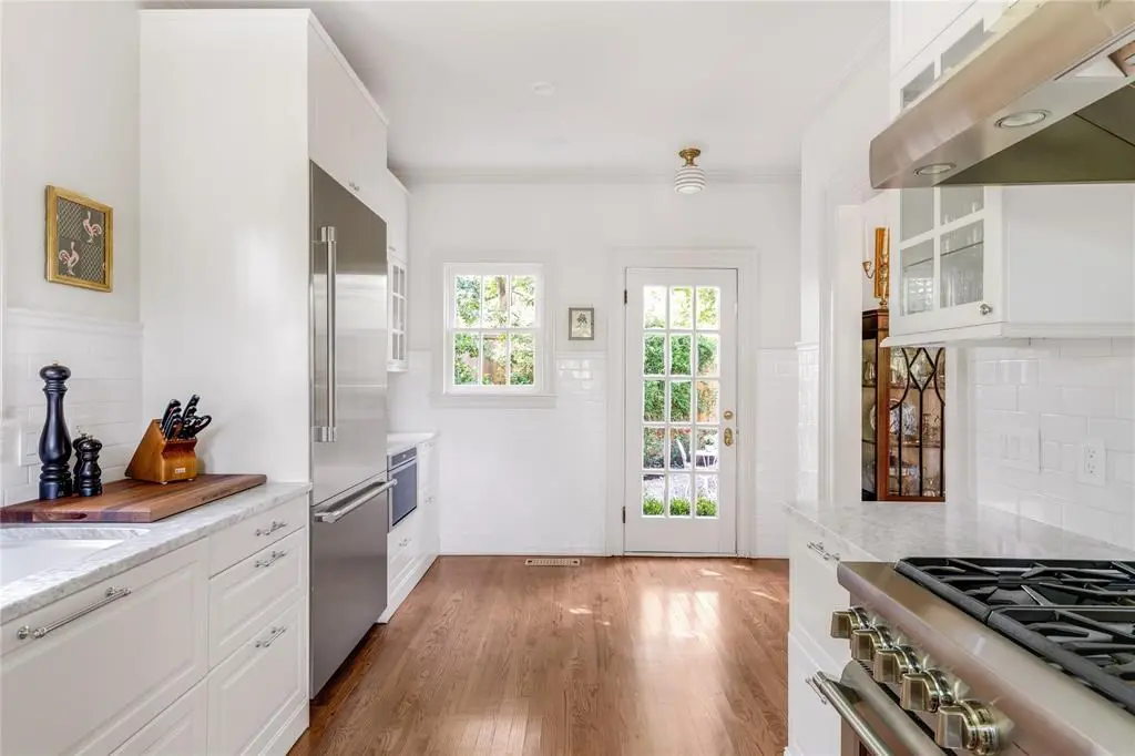 The kitchen is a stunning blank slate with high-end Thermador appliances. 