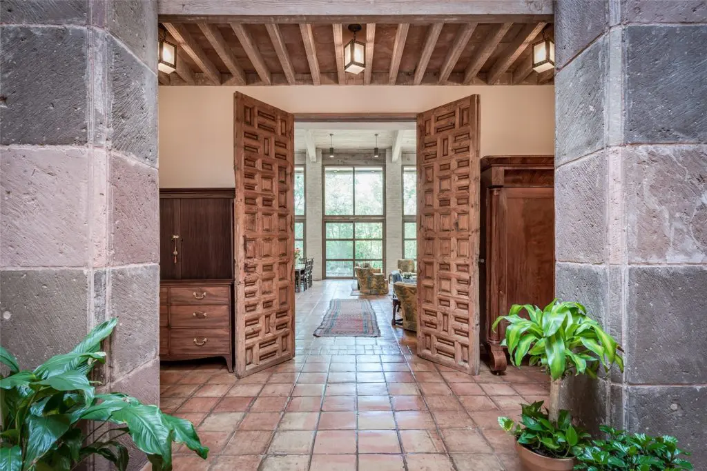 Antique doors in the O'Neil Ford designed home at 3 Longbow Lane were sourced from Mexico. (Photo by Patrick Bertolino for Sotheby's International Realty)
