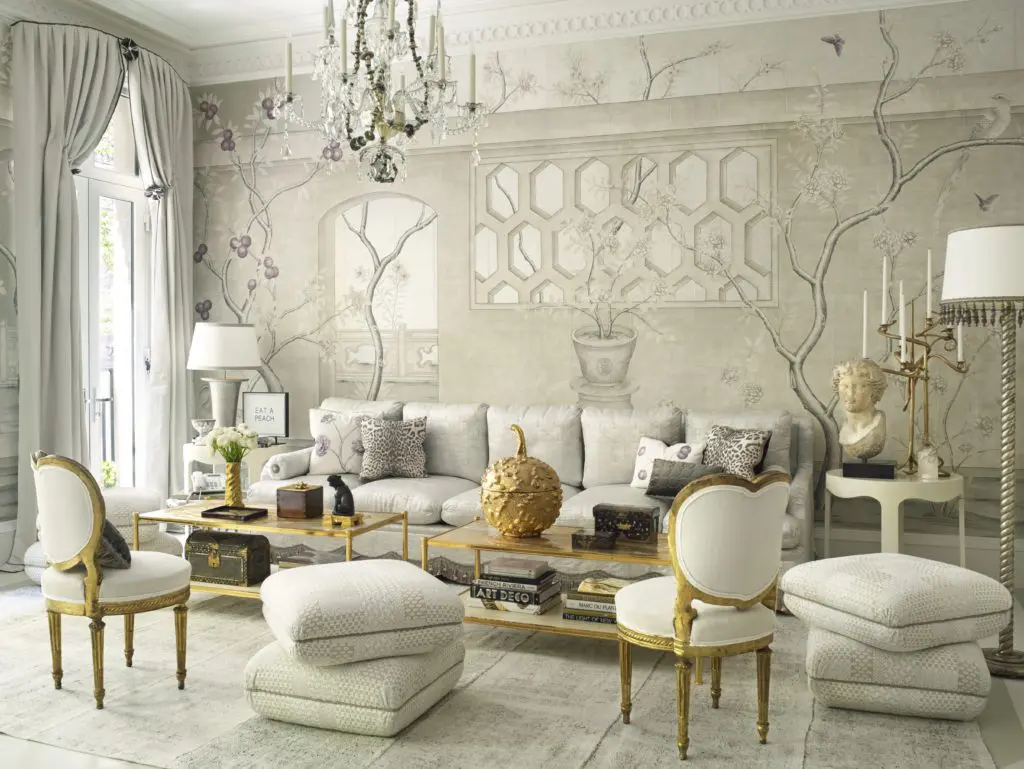 In the multipurpose room of the 2016 Kips Bay Decorator Show House, Frederick P. Victorian & Son made the coffee tables, which have custom tops fashioned by artist Nancy Lorenz; one bears a ceramic gourd by Christopher Spitzmiller. In addition to the 18th-century Italian giltwood chairs with heart-shaped backs from Dalva Brothers are Turkish-style poofs and a fringed sofa made of Cowtan & Tout fabric and Samuel & Sons trim. (Photo by Tria Giovan)