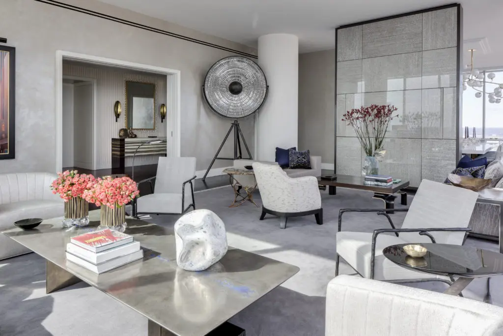  On Billionaires’ Row in New York, a serene living room designed by Drake/Anderson maintains the bold point of view established in the foyer. Two seating groups are as welcoming for private reflection and intimate tête-à-têtes as for larger gatherings. (Photo by Marco Ricca)