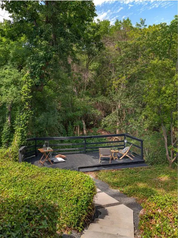 A backyard deck immerses you in the neighborhood's natural beauty. 