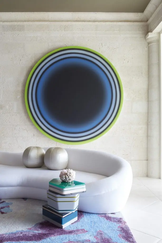 In a Naples, Florida, house, a gemstone side table by Hella Jongerius and a free-form sofa custom-designed by Stephen Sills. (Photo by Simon Upton)