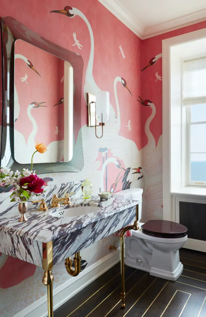 In a co-op in Chicago with stunning architectural details, Summer Thornton unwound the seriousness with something wild in the bath. “I’m obsessed with the giant white cranes on this unabashedly pink background. The FontanaArte mirror over the sink may be a bit of an acquired taste, but it works perfectly here because it inserts levity. It introduces a slight jade color, and I can see through the frame to the birds’ feathers. The birds are way too big for the space, and that’s why they are perfect here. Everything else is so meticulously done and incredibly polished that we needed the birds to ruffle a few feathers." (Photo by Thomas Loof)