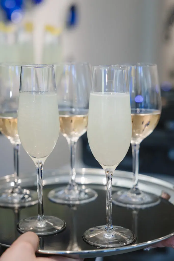The signature drink at the "Wanderlust" opening at Laura Rathe Fine Art was a French 75. (Photo by Johnny Than)