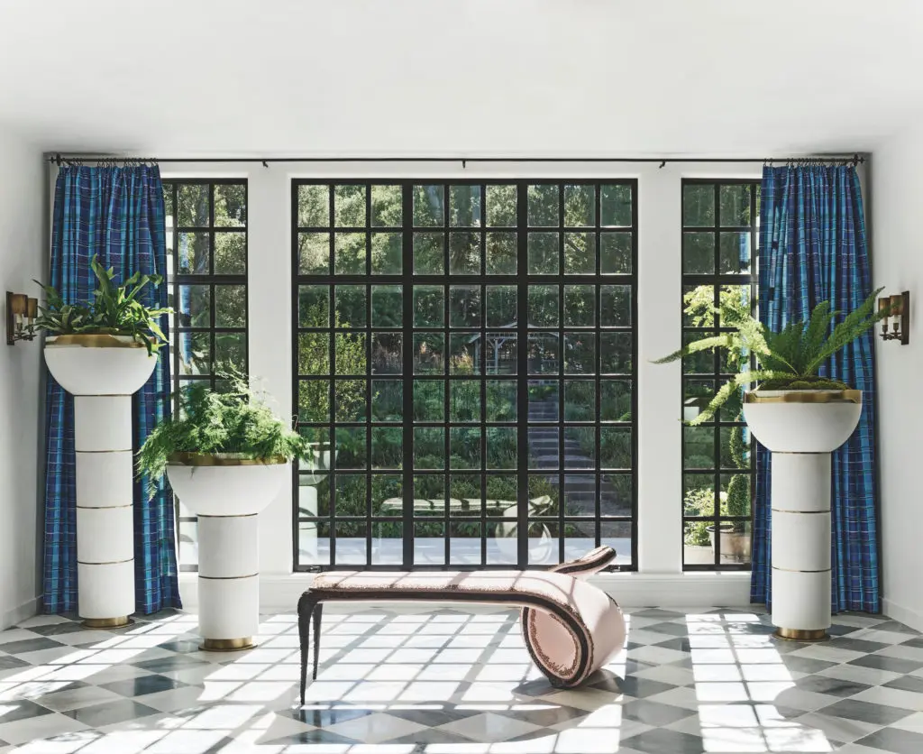 A storybook Tudor estate on five acres in Silicon Valley was built in 1921 as the country estate of a prominent San Francisco family. A century later, it’s been reimagined by Ken Fulk as a full-time family home and injected with a heavy dose of fashion and rock-star details. Woven leather, embossed metal, and high-gloss lacquer live alongside collectible objects and artworks by Picasso, Cindy Sherman, Basquiat, and Barbara Kruger. (Photo by Douglas Friedman)