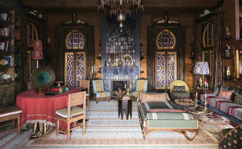 In a dacha in Normandy situated on the grounds of a neo-Gothic 19th century villa once owned by Yves Saint Laurent and Pierre Berge, is a pair of nineteenth-century sleeper chairs upholstered in Décors Barbares, Fortuny and Le Manach with Houlès piping. Set of eight 3D-printed, custom-designed JLD stained and sandblasted pin shelves. Set of nine antique samovars. Ceramic stove designed by JLD, created by by Nikolai Koshelev. Bronze-cast mushroom shelves for traditional Russian fashion figurines