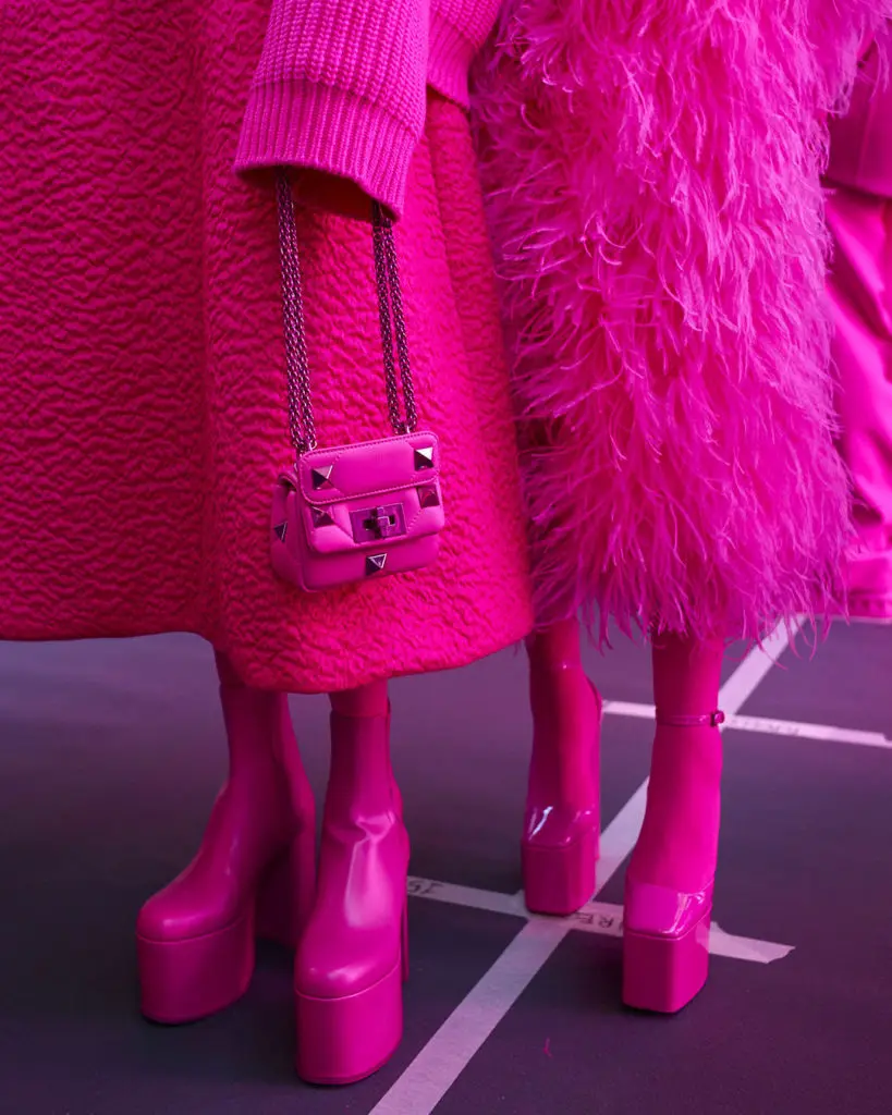 Models ready to walk at the Valentino PP Collection show embraced the pink fashion.