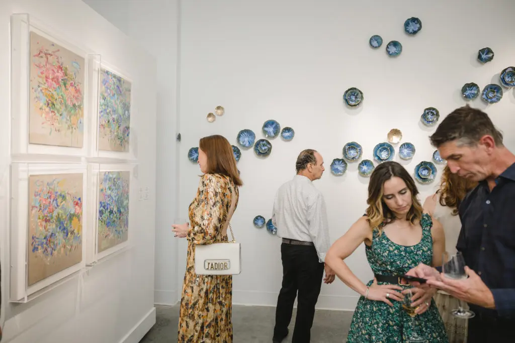 Art gazing at "Wanderlust" opening at Laura Rathe Fine Art (Photo by Johnny Than)