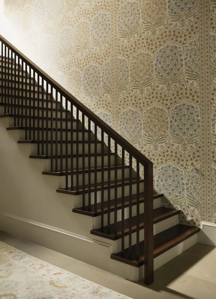 Lee Jofa, Sameera in Sapphire/Gold wallpaper in the stairwell of this West University home. (Photo by Jack Thompson)