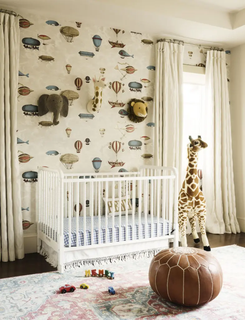 Cole & Son's Macchine Volanti Stone/Rouge Blu whimsical wallpaper in the baby's room. (Photo by Jack Thompson)