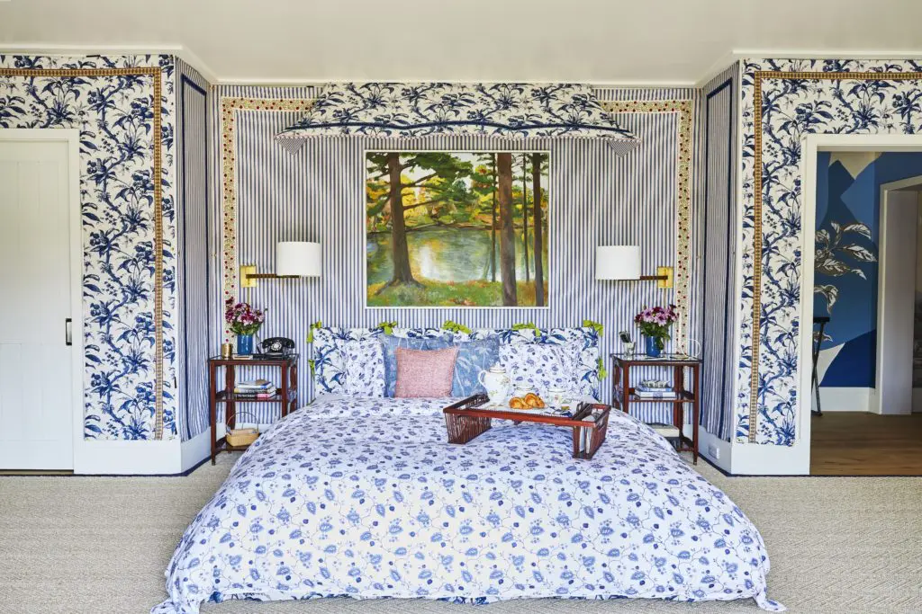 Richard Mishaan designed a space for Galerie magazine's first-ever show house. A painting by Jane Freilicher hangs above the bed, which is dressed in Schumacher fabrics for Matouk. The striped fabric is also by Schumacher; the swing-arm lamps are from Circa. (Photo by Genevieve Garruppo)