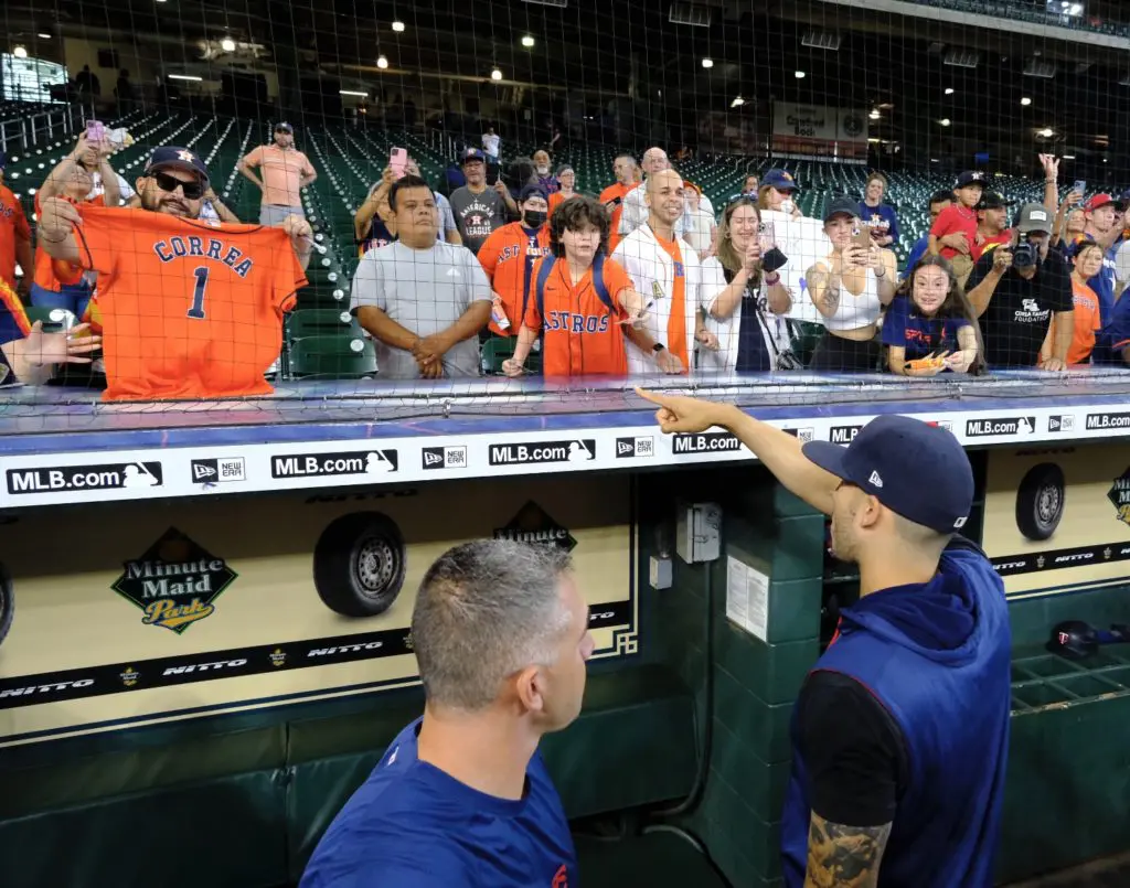 Carlos Correa pointed to Astros fans holding up his jersey in the Minute Maid Park stands. (Photo by F. Carter Smith)