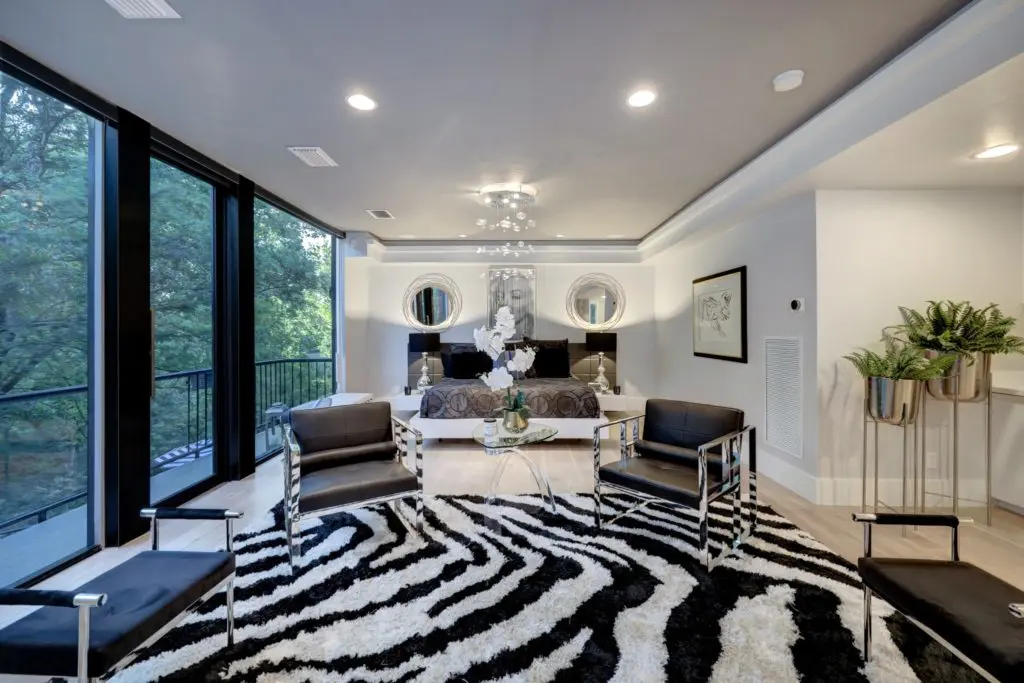 One of two primary suites in the home at 11686 Arrowwood Circle in Piney Point Village.  (Photo by TK Images for Martha Turner Sotheby’s International Realty  )