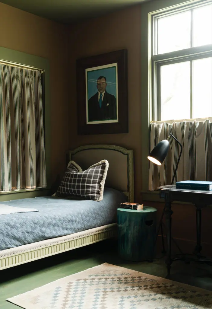 In the bedroom, the vintage rug is Turkish. Curtains are Ralph Lauren fabric. Painting from Belgium. (Photo by Jack Thompson)
